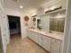Double vanity bathroom with a large shower at 10059 Crooked Creek Dr # 102, Venice, FL 34293