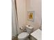Small bathroom with toilet and geometric wallpaper at 10059 Crooked Creek Dr # 102, Venice, FL 34293