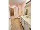 Bathroom with shower/tub combo and white vanity at 10059 Crooked Creek Dr # 102, Venice, FL 34293