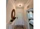 Bright entryway with a stylish mirror at 10059 Crooked Creek Dr # 102, Venice, FL 34293