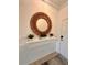 Bright entryway with decorative mirror and potted plants at 10059 Crooked Creek Dr # 102, Venice, FL 34293