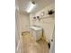 Laundry room with washer, dryer, and shelving at 10059 Crooked Creek Dr # 102, Venice, FL 34293