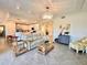 Living room with light beige couch, coffee table, and decorative accents at 10059 Crooked Creek Dr # 102, Venice, FL 34293