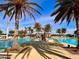 Resort-style pool with plenty of lounge chairs at 10059 Crooked Creek Dr # 102, Venice, FL 34293