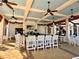 Relaxing pool bar with seating and ceiling fans at 10059 Crooked Creek Dr # 102, Venice, FL 34293