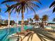Resort-style pool with plenty of lounge chairs at 10059 Crooked Creek Dr # 102, Venice, FL 34293