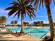 Resort-style pool with plenty of lounge chairs at 10059 Crooked Creek Dr # 102, Venice, FL 34293