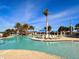 Resort-style pool with plenty of lounge chairs at 10059 Crooked Creek Dr # 102, Venice, FL 34293