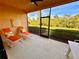 Relaxing screened patio with lounge chairs at 10059 Crooked Creek Dr # 102, Venice, FL 34293