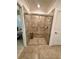 Large walk-in shower with neutral tile at 10059 Crooked Creek Dr # 102, Venice, FL 34293