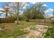 Backyard with fenced area, patio, and mature trees at 10814 Newbridge Dr, Riverview, FL 33579