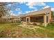 Large backyard with screened porch and partially fenced area at 10814 Newbridge Dr, Riverview, FL 33579