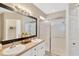 Clean bathroom with double sinks, a shower, and a large mirror at 10814 Newbridge Dr, Riverview, FL 33579