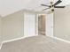 Simple bedroom with a closet and access to another room at 10814 Newbridge Dr, Riverview, FL 33579
