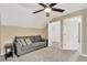 Cozy bedroom with a sofa and access to a closet at 10814 Newbridge Dr, Riverview, FL 33579