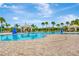 Community pool with multiple cabanas and lounge chairs at 10814 Newbridge Dr, Riverview, FL 33579