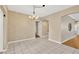 Simple dining area with tile flooring and a chandelier at 10814 Newbridge Dr, Riverview, FL 33579