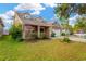 House exterior showcasing a well-maintained lawn and American flag at 10814 Newbridge Dr, Riverview, FL 33579