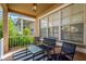 Relaxing front porch with seating and a striped rug at 10814 Newbridge Dr, Riverview, FL 33579