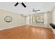Bright and airy living room with hardwood floors and large windows at 10814 Newbridge Dr, Riverview, FL 33579