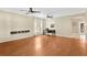 Spacious living room featuring hardwood floors and ceiling fans at 10814 Newbridge Dr, Riverview, FL 33579