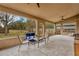 Relaxing screened porch with tiled floor and outdoor furniture at 10814 Newbridge Dr, Riverview, FL 33579