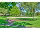Sand volleyball court surrounded by trees at 10814 Newbridge Dr, Riverview, FL 33579