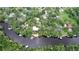 Aerial view showing house, riverfront property, and boat at 11554 Monette Rd, Riverview, FL 33569