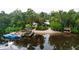 Aerial view showing waterfront property with boat dock and river access at 11554 Monette Rd, Riverview, FL 33569
