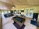 Large covered patio with foosball and game area at 11554 Monette Rd, Riverview, FL 33569