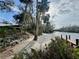Landscaped backyard with access to a private dock and river at 11554 Monette Rd, Riverview, FL 33569