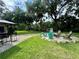 Relaxing backyard patio with firepit and seating area, perfect for outdoor entertaining at 11554 Monette Rd, Riverview, FL 33569