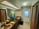 Bathroom with double sinks and access to backyard at 11554 Monette Rd, Riverview, FL 33569