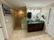 Bathroom with double sinks, glass shower, and granite vanity at 11554 Monette Rd, Riverview, FL 33569
