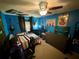 Blue bedroom with guitar and unique wall art at 11554 Monette Rd, Riverview, FL 33569