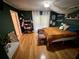 Bright bedroom with wood floors and built-in shelves at 11554 Monette Rd, Riverview, FL 33569