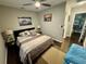 Guest bedroom with a queen bed and tranquil decor at 11554 Monette Rd, Riverview, FL 33569