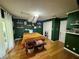 Spacious bedroom with wood floors and green walls at 11554 Monette Rd, Riverview, FL 33569