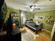 Bedroom with wood floors and eclectic decor at 11554 Monette Rd, Riverview, FL 33569