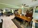 Open dining room, stone fireplace, and views into the living room at 11554 Monette Rd, Riverview, FL 33569