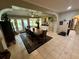 Bright dining room features a large wooden table and access to kitchen at 11554 Monette Rd, Riverview, FL 33569