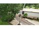 Brick driveway leading to a detached building with landscaping at 11554 Monette Rd, Riverview, FL 33569