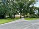 Brick driveway leading to a large home with lush landscaping at 11554 Monette Rd, Riverview, FL 33569