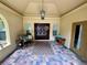 Inviting front entry with double doors, tile flooring and decorative wreaths at 11554 Monette Rd, Riverview, FL 33569