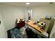 Functional home office with a desk, comfortable chair, and ample storage at 11554 Monette Rd, Riverview, FL 33569