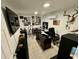 Home office featuring a large screen TV and ample workspace at 11554 Monette Rd, Riverview, FL 33569