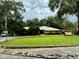 Single-story home with metal roof and large front yard at 11554 Monette Rd, Riverview, FL 33569