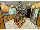 Kitchen boasts an island, stainless steel appliances, and pot rack at 11554 Monette Rd, Riverview, FL 33569