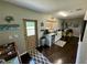Modern kitchen with granite counters, mini-fridge, and beachy decor at 11554 Monette Rd, Riverview, FL 33569