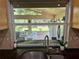 Kitchen window view of backyard patio and seating area at 11554 Monette Rd, Riverview, FL 33569